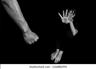 man are using force to coerce woman. scared woman lift hand up for say stop, to protect herself. stop domestic violence against women and anti human trafficking campaign.
