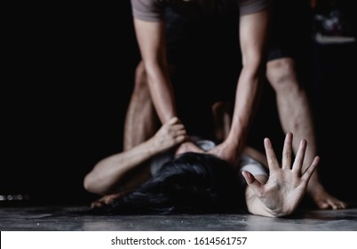 Man Are Using Force To Coerce Women. A Man's Hand Is Strangling A Girl Neck. Stop Domestic Violence Against Women Campaign.