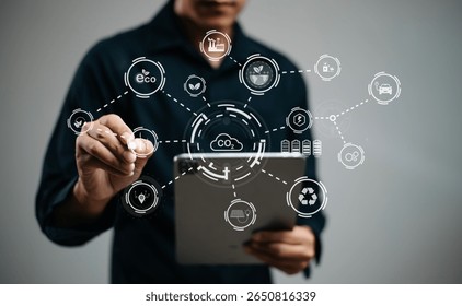 man using futuristic interface with smart tech and mobile to manage ESG, clean energy, and sustainability data. in office	