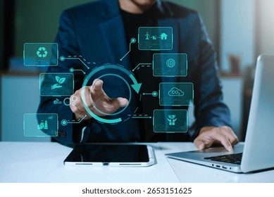Man using futuristic interface with smart tech and mobile to manage ESG, clean energy, and sustainability data in office	