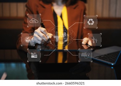 man using futuristic interface with smart tech and mobile to manage ESG, clean energy, and sustainability data. in office	