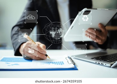 Man using futuristic interface with smart tech and mobile to manage ESG, clean energy, and sustainability data.