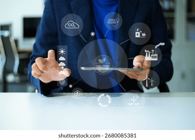 Man using futuristic interface with smart tech and mobile to manage ESG, clean energy, and sustainability data.	