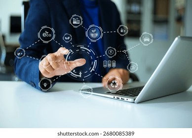 Man using futuristic interface with smart tech and mobile to manage ESG, clean energy, and sustainability data.	