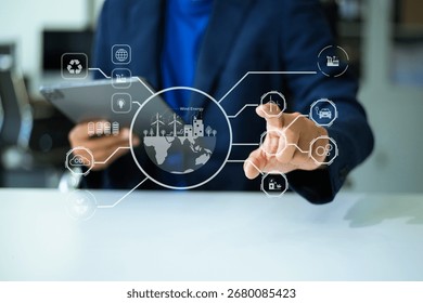 Man using futuristic interface with smart tech and mobile to manage ESG, clean energy, and sustainability data.	