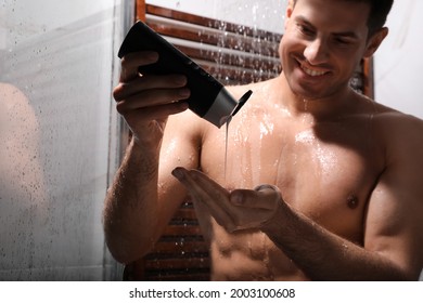 Man using gel in shower at home, closeup