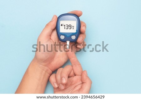 Man using glucometer, blood glucose test. Diabetes concept