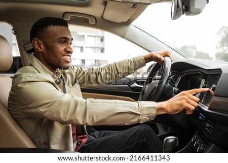 Man Using Gps Navigation System In Car to travel