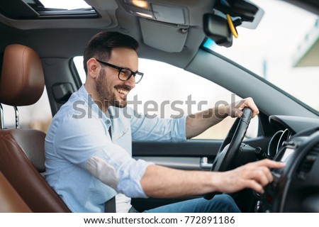 Man Using Gps Navigation System In Car to travel
