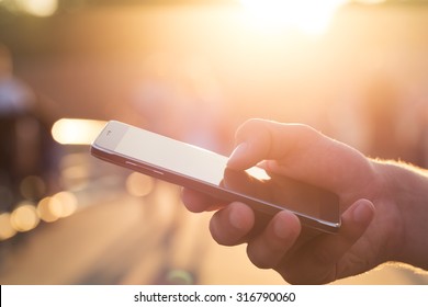 Man Using His Mobile Phone Outdoor, Close Up