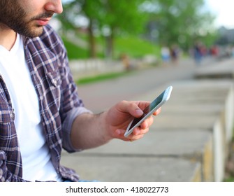 Man Using His Mobile Phone Outdoor, Close Up