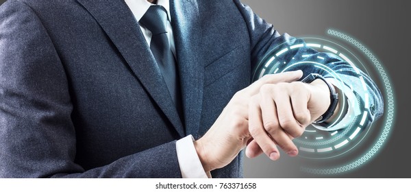 Man using his smartwatch with virtual hologram