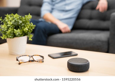 Man Using Home Assistant Bluetooth Speaker