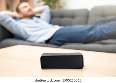 Man Using Home Assistant Bluetooth Speaker