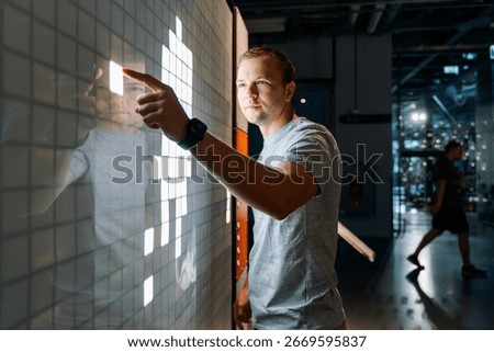 Man Using Interactive Touchscreen Panel