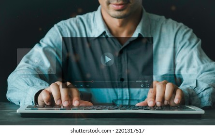 Man using the keyboard for streaming online on virtual screen, watching video on the internet, live concert, show or tutorial, content online. on the internet concept