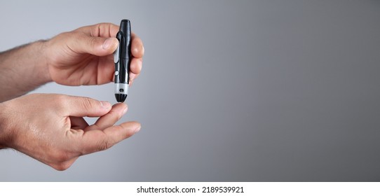 Man Using Lancet On Finger Checking Stock Photo 2189539921 | Shutterstock