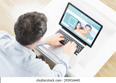 Man Using Laptop Against Dating Website