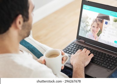 Man using laptop against dating website