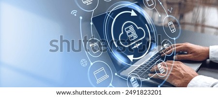 Man using laptop, cloud service hologram hud on screen, files share or transfer. Empty copy space background. Concept of information storage, computer backup and synchronization