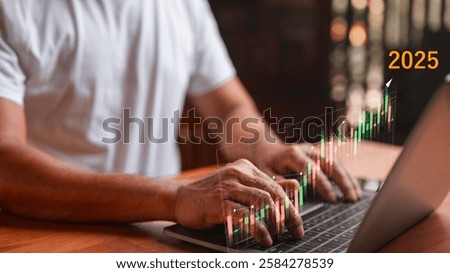 Man using laptop computer to analyze stock market speculation trading graph in 2025, financial investment concept in stock market.