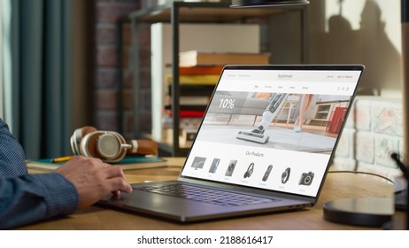 Man Using Laptop Computer, Online Shopping for Electronics, Wireless Hi-Fi Headphones, Vacuum Cleaners, Speakers. e-Commerce Concept of Purchasing, Buying, Ordering Tech Devices on Website. - Powered by Shutterstock