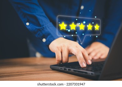 Man Using Laptop Computer To Rate Service Experience In Application Online. Customer Reviews Opinion Poll Satisfaction Survey And Testimonial.