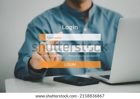 man using laptop computer and sign up or log in username password virtual touch screen.