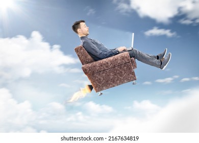 Man using a laptop computer while flying through the sky