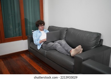 man using laptop computer for working or studying online at home