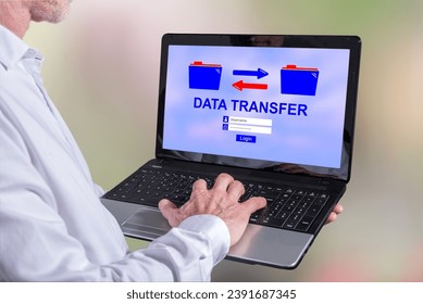 Man using a laptop with data transfer concept on the screen