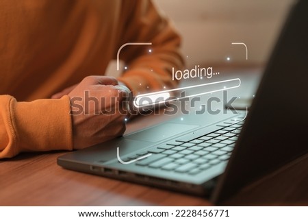 Man using laptop for download software and waiting to loading digital business data form website, concept of waiting for load of loading bar.