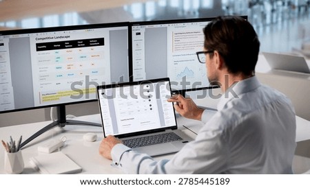 Man Using Laptop To Edit AI Strategy And Business Presentation Documents.