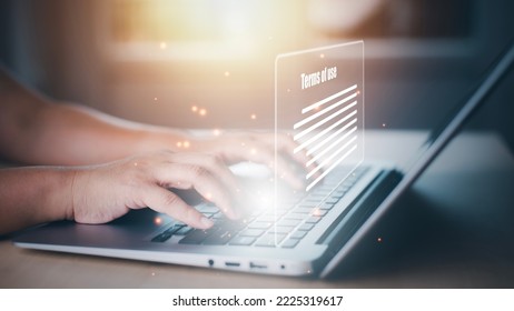 Man using a laptop with a graph of Terms of use concept, online banking check budget planning concept banner for website header design,Terms of use business concept. Terms and conditions of contract.