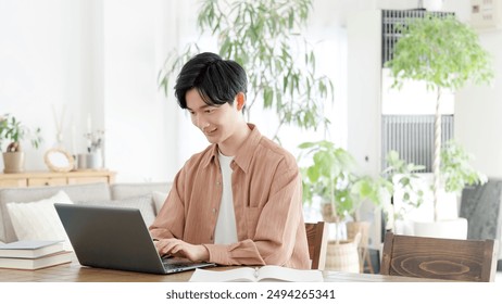 Man using laptop at home - Powered by Shutterstock