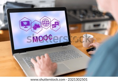 Man using a laptop with mooc concept on the screen