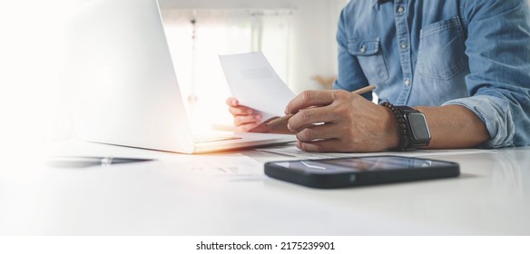 Man using laptop at office.