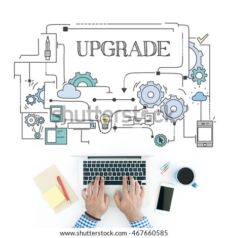 Man using laptop on workplace and UPGRADE concept