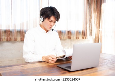 A man using a laptop for remote work