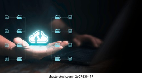 Man using laptop and showing cloud technology and data management on palm. Cloud computing concept with streaming data transfer.