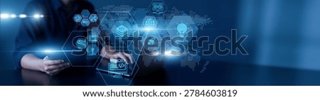 Man using laptop and tablet to analyze web development data. user interaction, website performance, responsive design, SEO analytics, and frontend-backend integration.