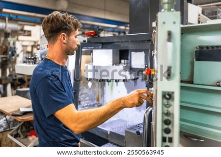 Man using mechanical machine to mold plastic parts in a cnc factory Stock photo © 