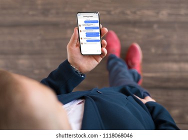 Man using messaging app on phone