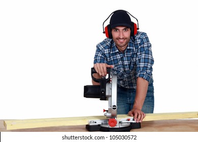 Man Using A Mitre Saw