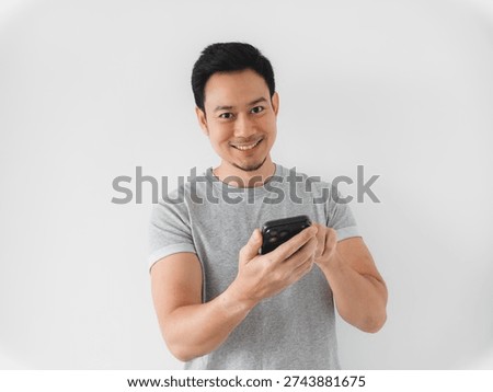 Man using mobile banking app on smartphone, focused expression entering passcode, digital finance context with secure transaction