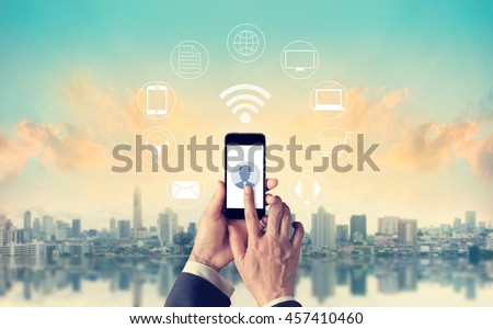Man using mobile payments, holding circle global and icon customer network connection, Omni Channel or multi Channel 