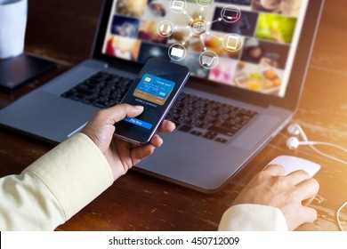 Man using mobile payments online shopping and icon customer network connection on screen, m-banking and omni channel 