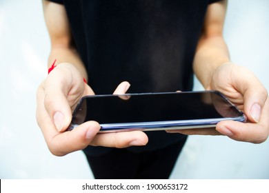 A man using a mobile phone.