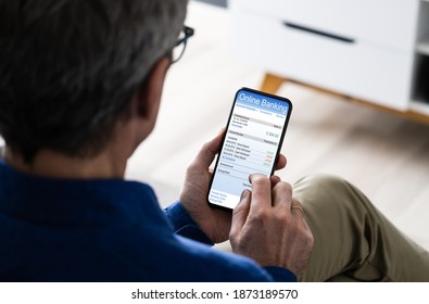 Man Using Mobile Phone Checking Bank Statement Online