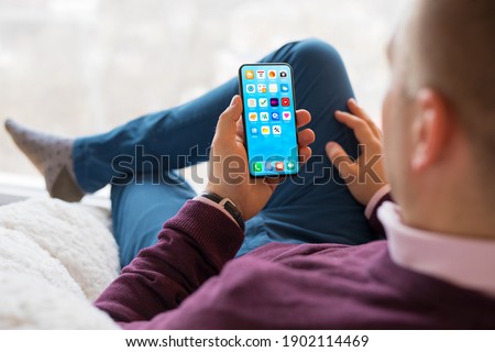 Man using mobile phone at home